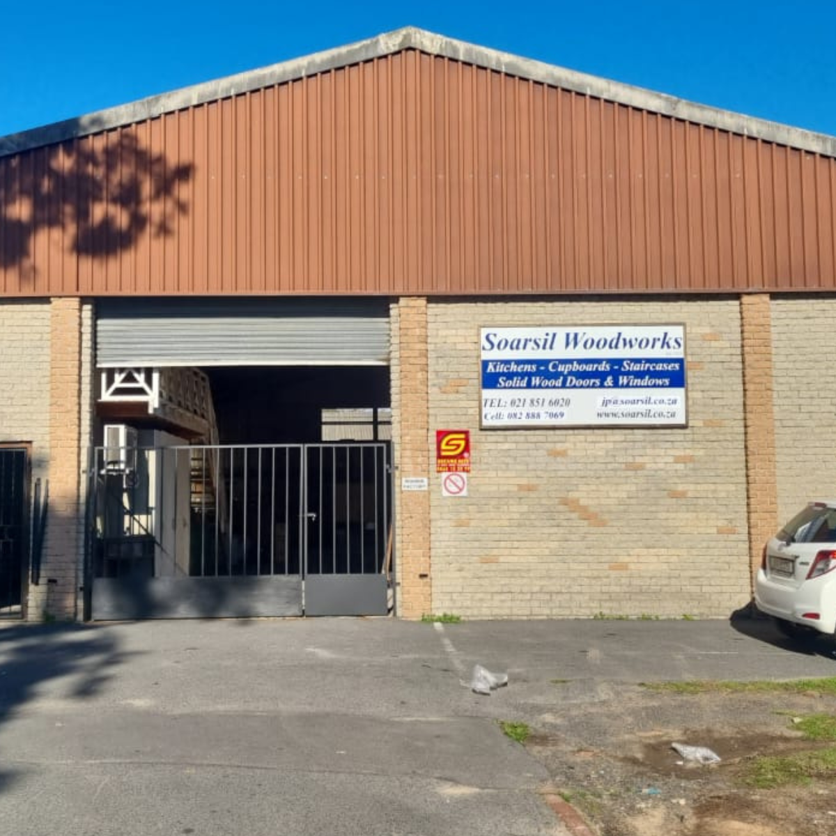 Soarsil Woodworks Workshop Exterior with Signage